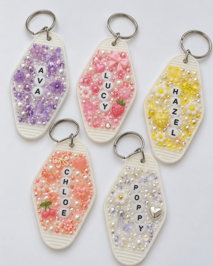 Keychain decorated with colorful rhinestones and pearls, a fun bedazzled DIY craft idea for personalized gifts, accessories, or girls night crafts.