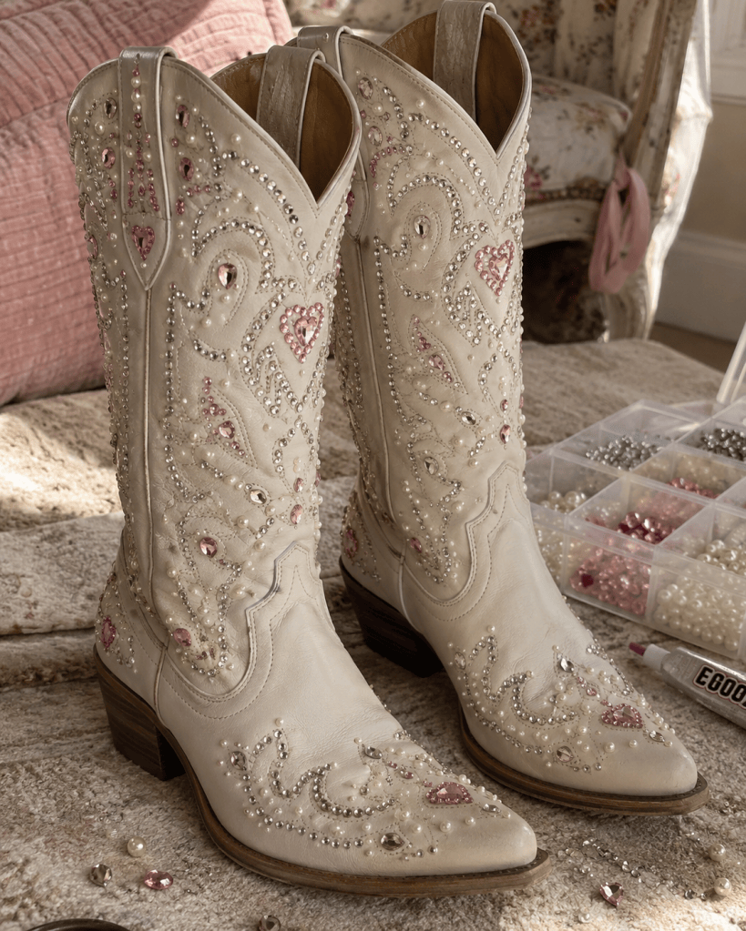 Cowboy boots decorated with colorful rhinestones and gems, a sparkly bedazzled DIY craft idea for western fashion, parties, gifts, or statement accessories.