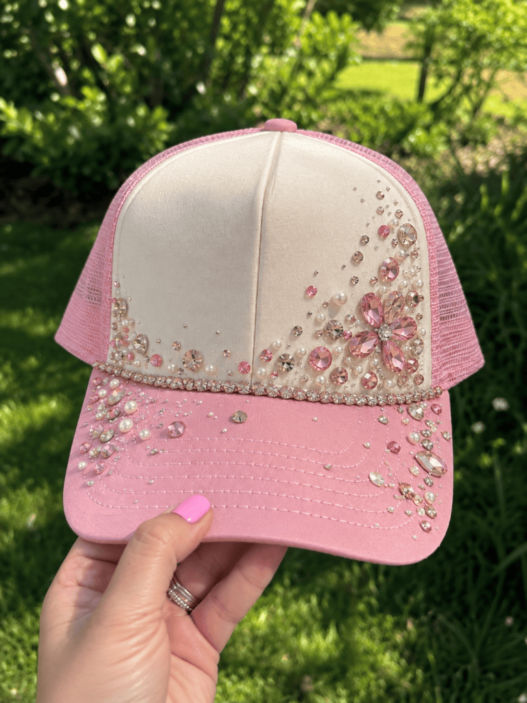 Trucker hat decorated with colorful rhinestones and gems, a trendy bedazzled DIY craft idea for parties, personalized gifts, or statement accessories.